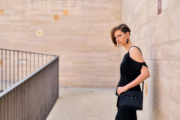 Model wears: CRISTIANE bag - Black, GIULIANA earrings - Black - BANIZS