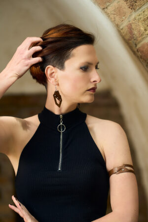 Model wears: GIULIANA - bold earrings - Brown and GIULIANA upper arm bracelet - Brown - BANIZS