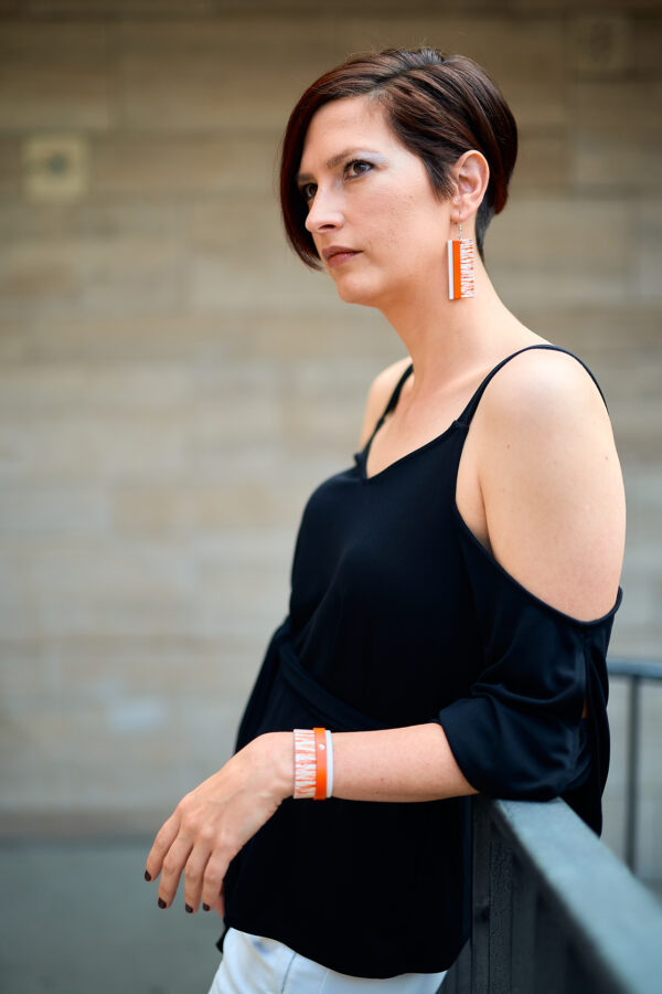 Layered leather earrings and bracelet orange